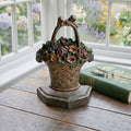 Hubley cast iron doorstop styled in a French garden room with an antique gardening book
