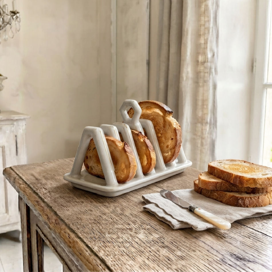 Antique toast rack styled with French country breakfast table
