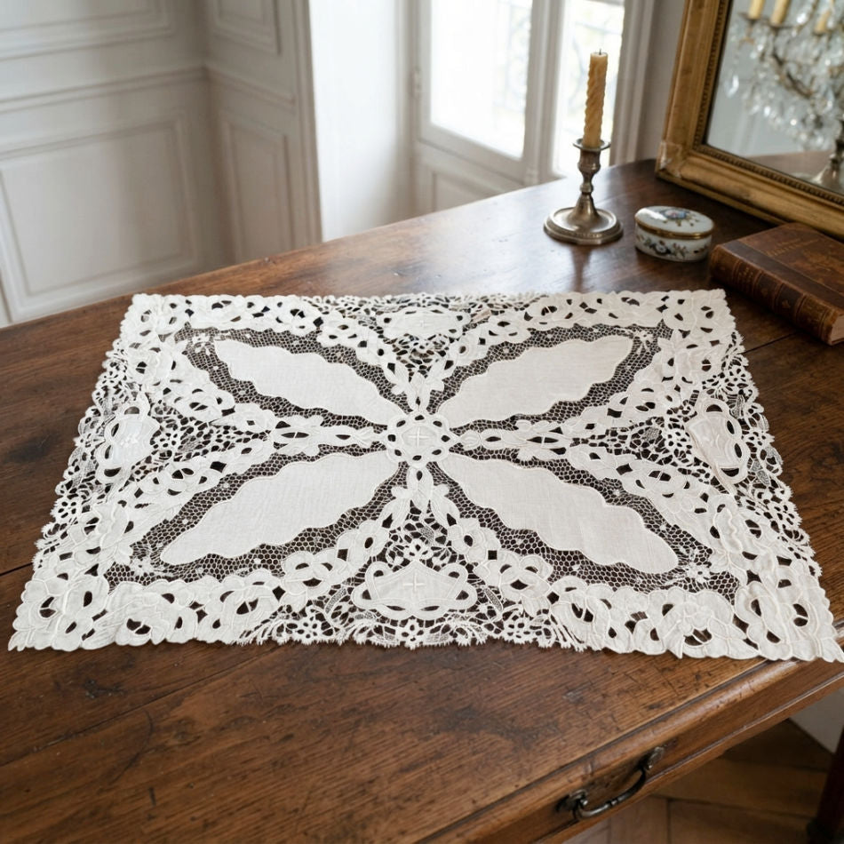 Antique cream linen floral embroidered lace centerpiece styled on a French table