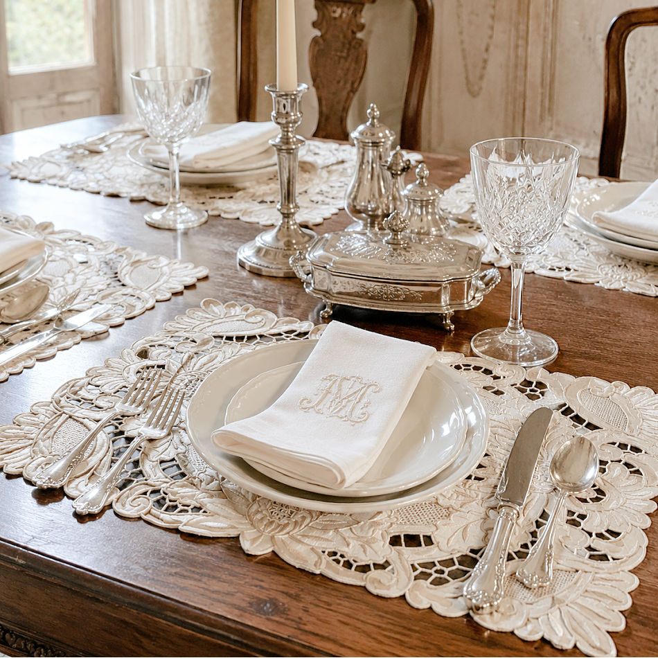 Antique Madeira embroidered linen placemats elegantly styled on an antique French dining table