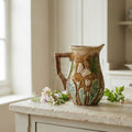 Antique French majolica pitcher with violets and butterflies