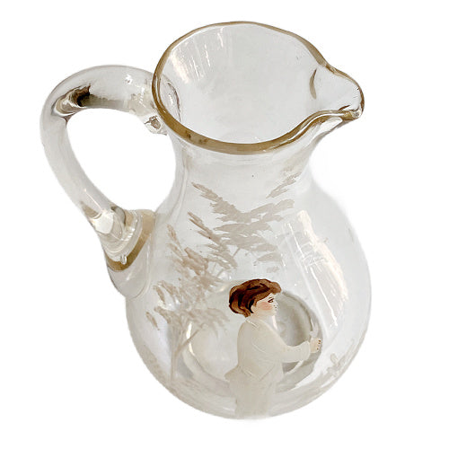 Antique Mary Gregory glass pitcher with hand painted boy and white enamel trees-top