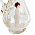 close up of Antique Mary Gregory glass pitcher with hand painted boy and white enamel trees