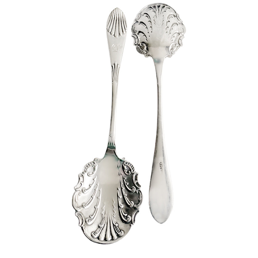 A charming pair of antique silver-plated jam spoons, monogrammed “D” and hand-engraved with rococo shell and leaf motifs.