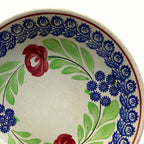 Antique stick spatterware plate with colorful floral garland