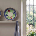Antique floral pottery plate styled in a French country kitchen