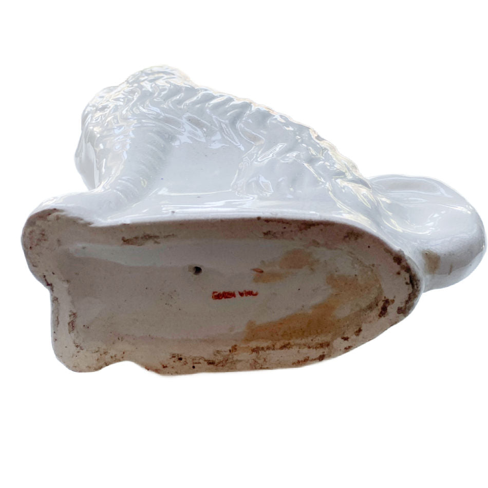 Antique Staffordshire dog marked England on underside