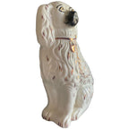 Side detail of 19th century English Staffordshire dog with pink lustre collar and chain