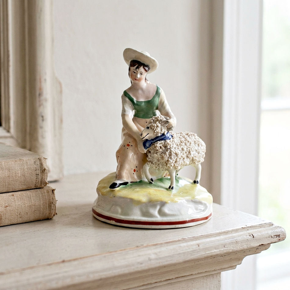 Antique Staffordshire sheep shearing figure with shepherdess, circa 1835 on French mantel