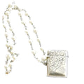 Antique sterling silver English vesta necklace with engraved match safe and pearl chain. A rare heirloom piece of antique jewelry.