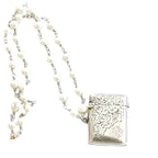 Antique sterling silver English vesta necklace with engraved match safe and pearl chain. A rare heirloom piece of antique jewelry.