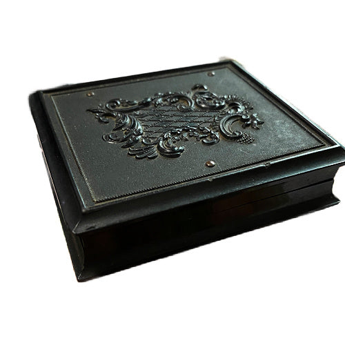 Antique Union case with elegant scrolled pattern, signed James & Co, featuring a single 19th-century woman portrait inside. Collectible photographic case.