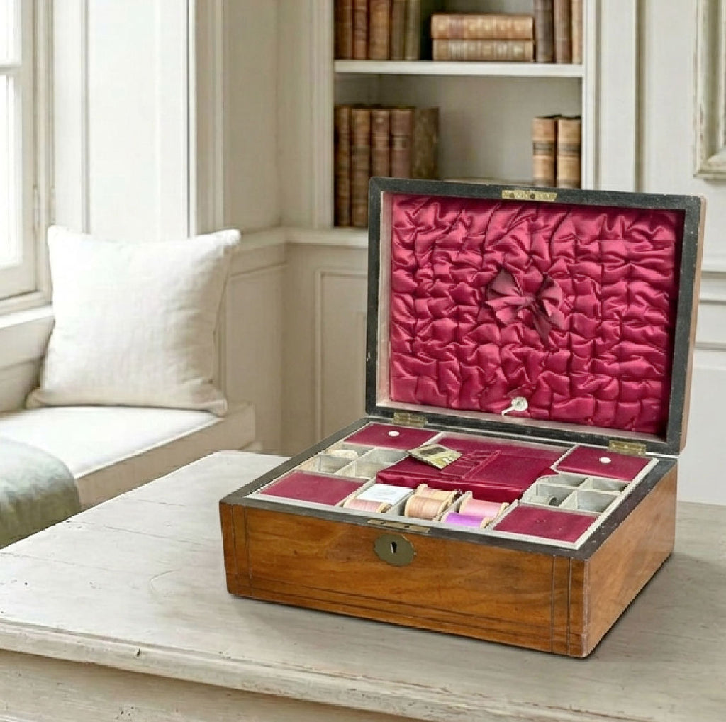 Antique 19th-century Victorian inlaid sewing box with warm wood finish and brass detailing on French desk