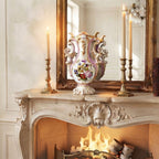 Antique Vieux Paris hand-painted pink rose porcelain vase displayed on a French mantel with candles, fire, and mirror