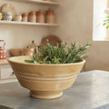 Antique Yelloware Bowl with Cream Stripes, hand thrown on a potter's wheel and hand glazed in french country kitchen with herbs