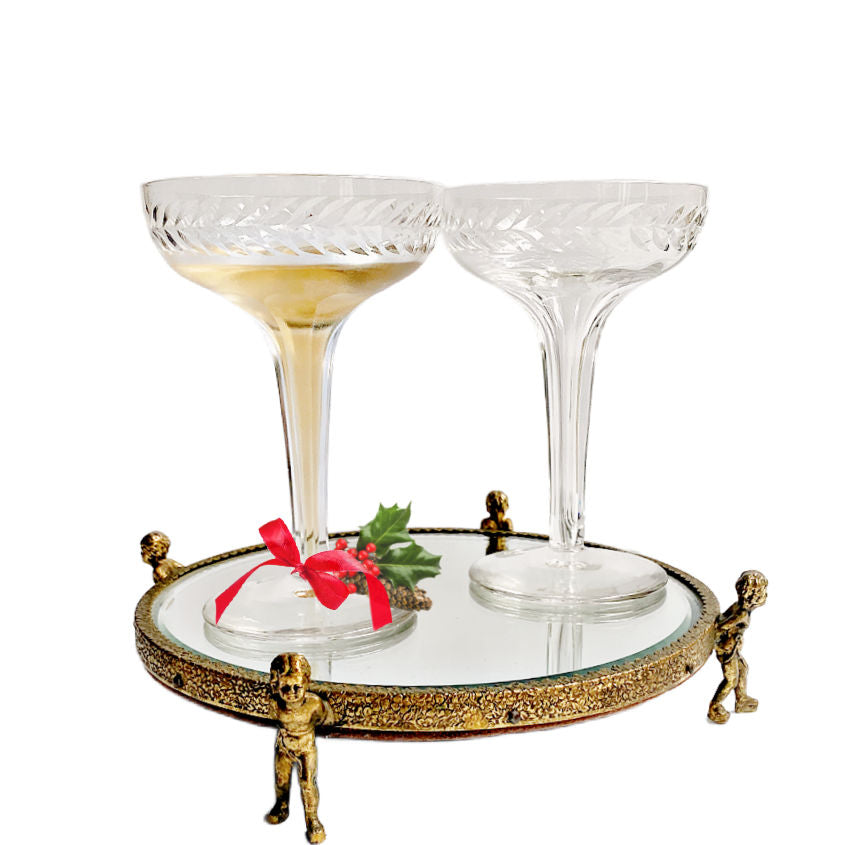 Vintage gilded cherub beveled mirror vanity pedestal, 9". Four cherub feet support a round beveled mirror—perfect for perfume, jewelry, and French boudoir décor.