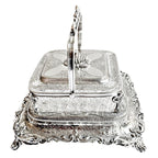 
English silver sardine server cut crystal liner ornate repoussé detailing