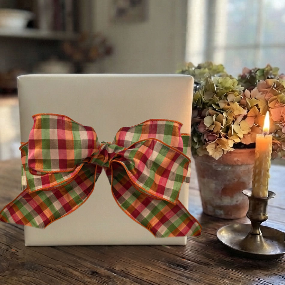 Apple green autumn check ribbon tied around an elegant wrapped gift