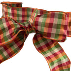 Apple green, orange, beige and red check ribbon used as a gift bow