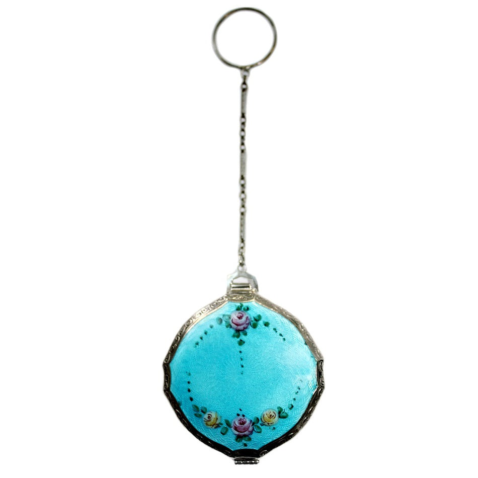 A vintage Art Deco compact with Aqua Blue Guilloche and pink roses design, complete with a chain and finger ring.