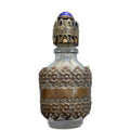 Exquisite Art Deco miniature perfume bottle with sapphire blue glass jewel and ornate gold filigree lid. A rare antique vanity treasure of timeless elegance.