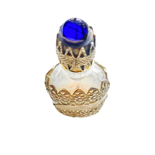 Exquisite Art Deco miniature perfume bottle with sapphire blue glass jewel and ornate gold filigree lid. A rare antique vanity treasure of timeless elegance.