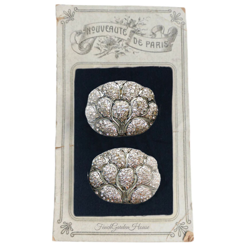 Art Deco rhinestone fan-motif shoe buckles from the 1920s–30s. A glamorous vintage pair with architectural design and brilliant sparkle.