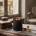 Automne Doré luxury candle glowing in an elegant Paris-inspired interior with warm autumn candlelight