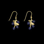 Artisan-made bronze earrings inspired by wild blueberries, featuring green patina leaves and shimmering blue glass berries