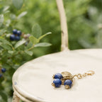 Michael Michaud Lapis Blueberry charm on cream French metal garden chair with blueberries