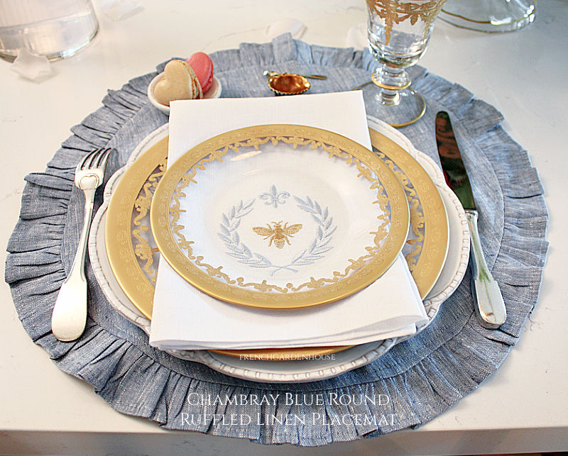 Italian Bee Linen Tri-Fold Napkin by Arte Italica with a blue round placemat