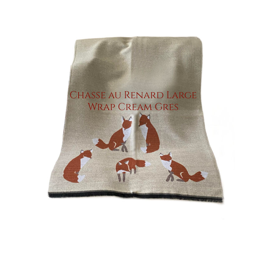 A luxury cream-colored wrap with a large fox design to wear or use as a thrw
