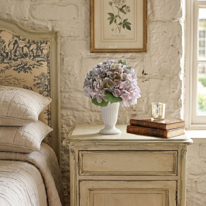 Château de Lorraine hydrangea bouquet arranged in a vase in a French country bedroom