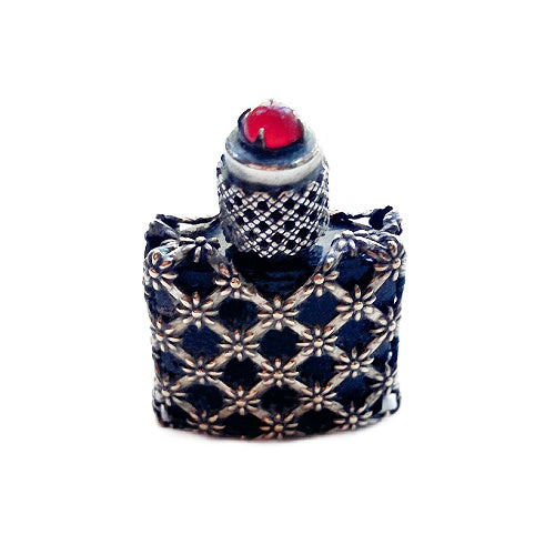 Delicate Art Deco French silver mini perfume bottle with ruby‑tone glass jewel — a finely crafted collectible treasure.