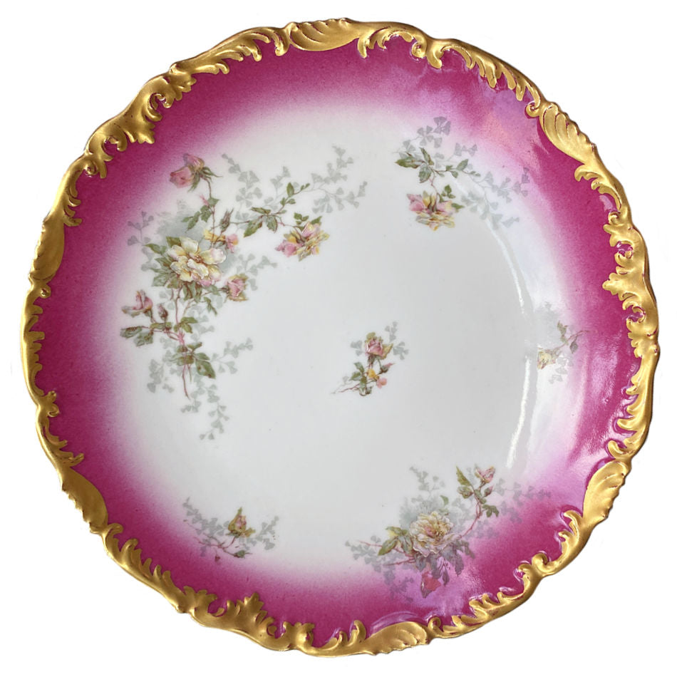 Early 1900s T&V Limoges porcelain plate with pink and yellow roses, cerise pink border, and elaborate gilt scalloped rim.