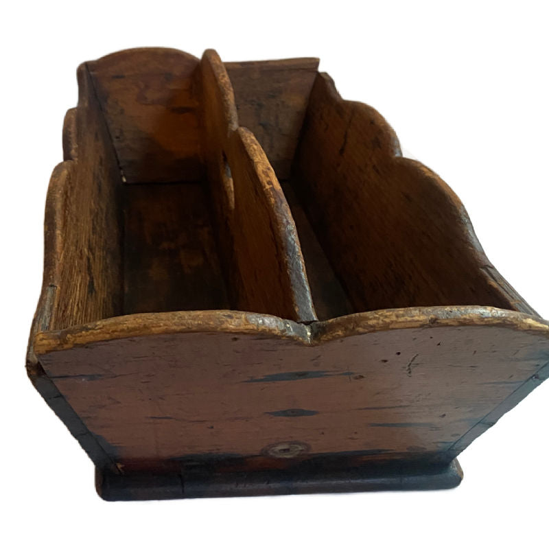 A delightful Early 19th Century French Country Kitchen Work Box, made of richly aged wood with gracefully scalloped sides and a center carrying handle.