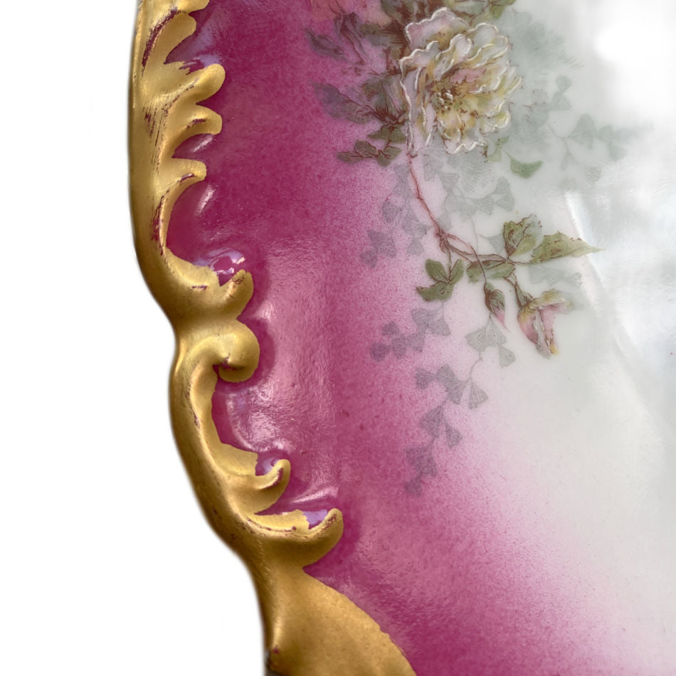 Detail of the embossed raised scalloped rim with elaborate hand-applied 22-karat gold decoration on rare pink Limoges roses plate