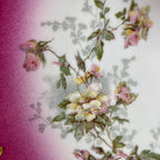 Detail of hand-painted pink and yellow roses and enameled decoration on antique French Limoges porcelain late with rare cerise hot pink color