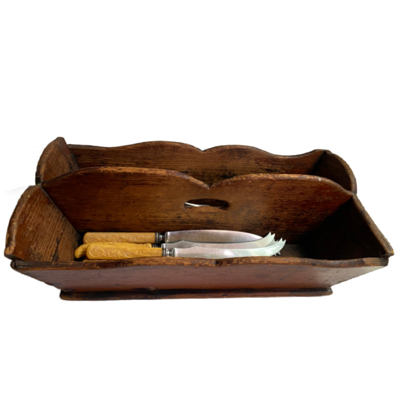 A delightful Early 19th Century Country Kitchen Work Box, made of richly aged wood with gracefully scalloped sides and a center carrying handle.