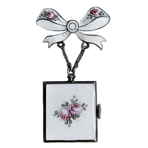 Edwardian sterling silver watch pin with white guilloché enamel, hand-painted roses and bow motif, a refined early 20th century jewel.