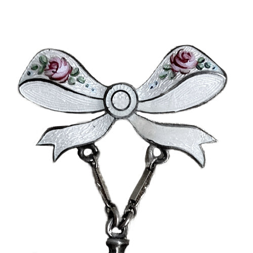 Edwardian sterling silver watch pin with white guilloché enamel, hand-painted roses and bow motif, a refined early 20th century jewel.