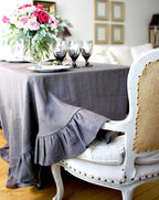 Elegant French Country dining table with grey linen round tablecloth
