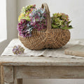 Antique French Hand-Woven Panier à Fesses, Antique Splint Basket with hydrangeas on a french table