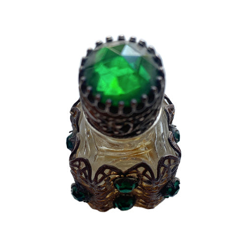 Exquisite Art Deco miniature perfume bottle adorned with emerald glass jewels and intricate gilt filigree. A romantic collector’s treasure of timeless elegance.