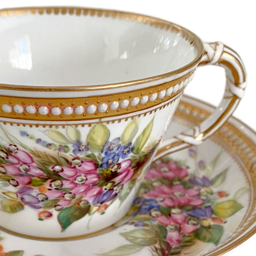 Close-up of raised jeweled enamel decoration on antique Royal Worcester porcelain with fine gilt detailing