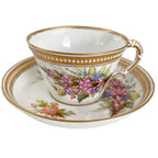 Antique Royal Worcester porcelain cup with hand-painted flowers, raised jeweled decoration, and gilt accents