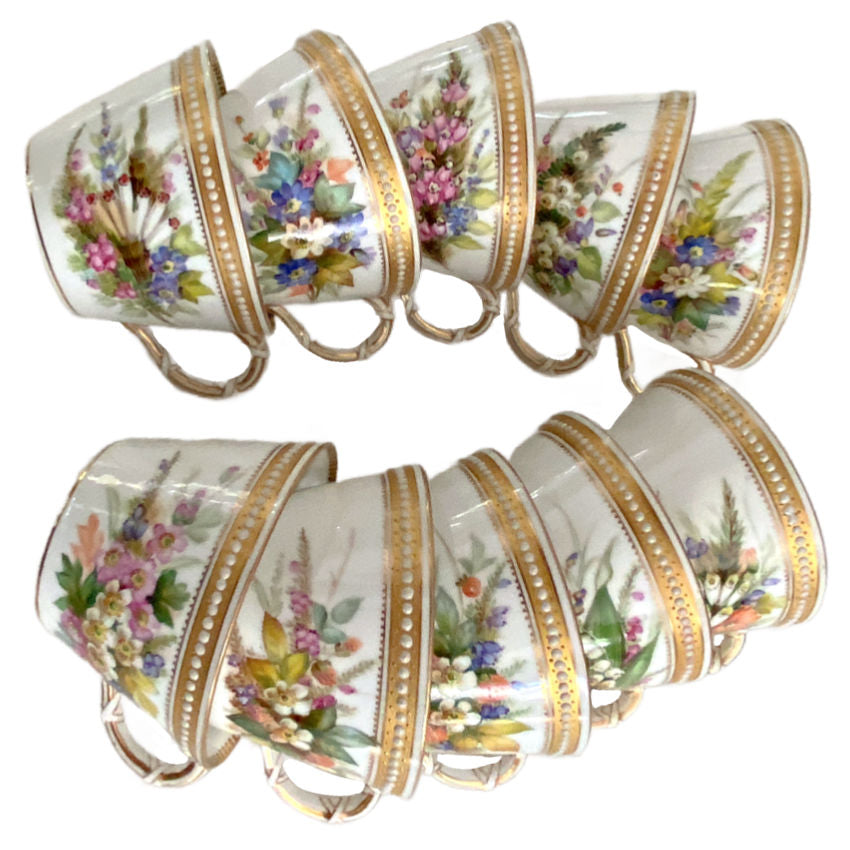 Collection of ten antique Royal Worcester porcelain cups with individually hand-painted floral designs and jeweled decoration