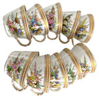 Collection of ten antique Royal Worcester porcelain cups with individually hand-painted floral designs and jeweled decoration