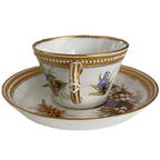 Antique Royal Worcester floral cup and matching saucer showcasing fine hand painting and raised jeweled decoration handle view