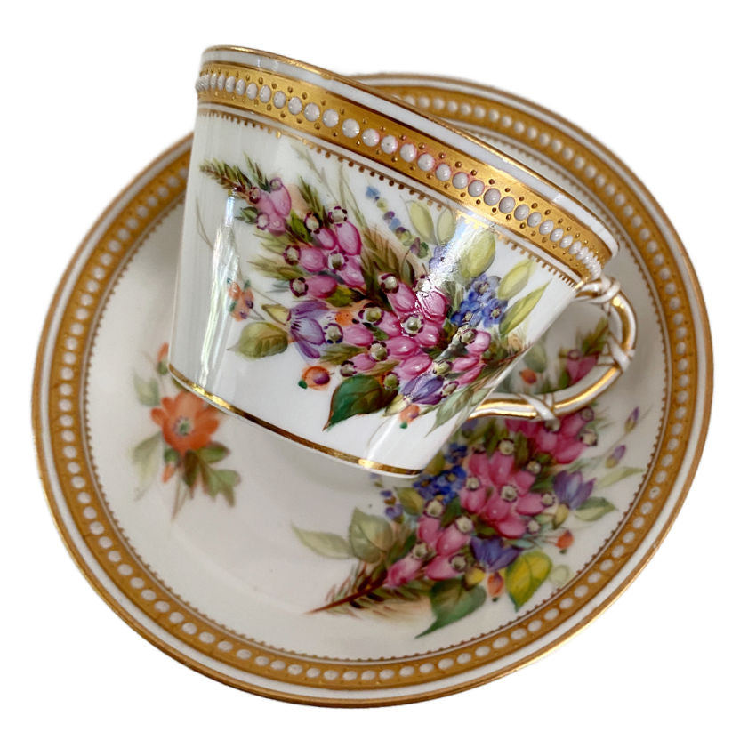 Detail of hand-painted flowers on an antique Royal Worcester porcelain cup, illustrating the individuality of each design
